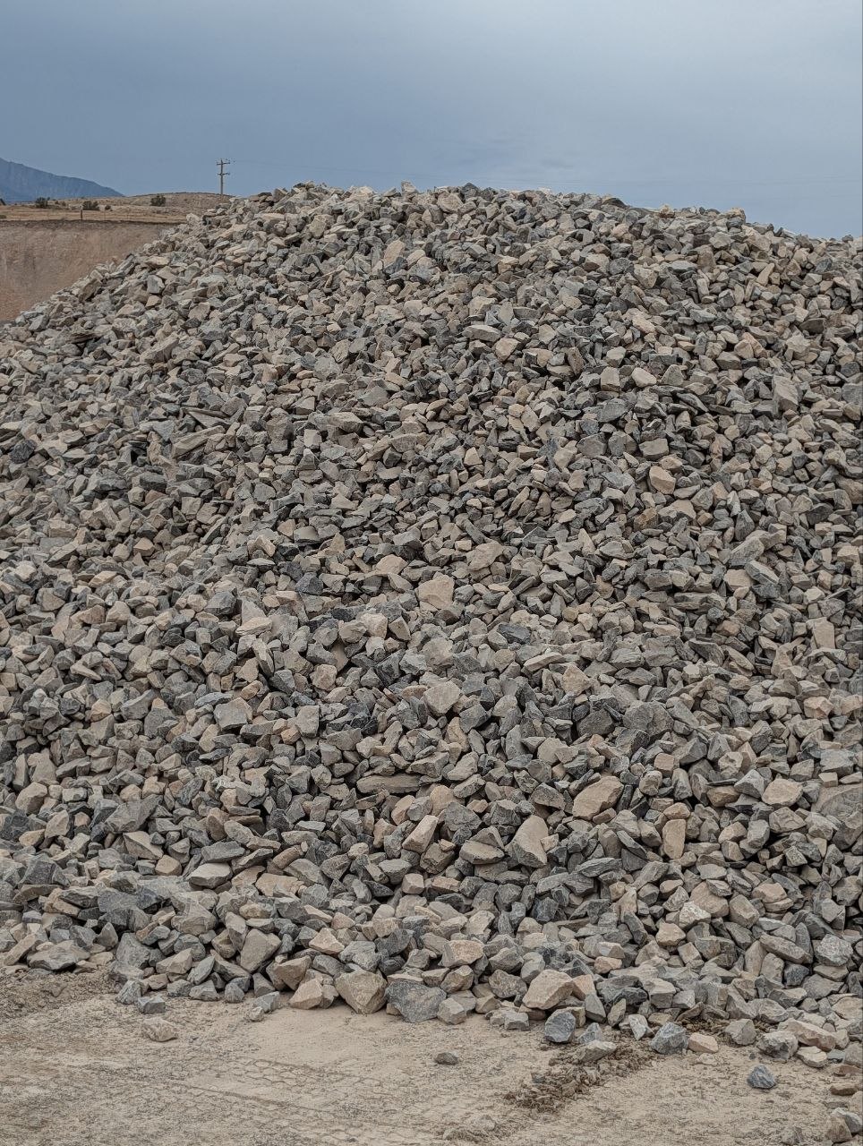 Stockpile of large 4 by 6 inch angular rock at a Utah aggregate yard