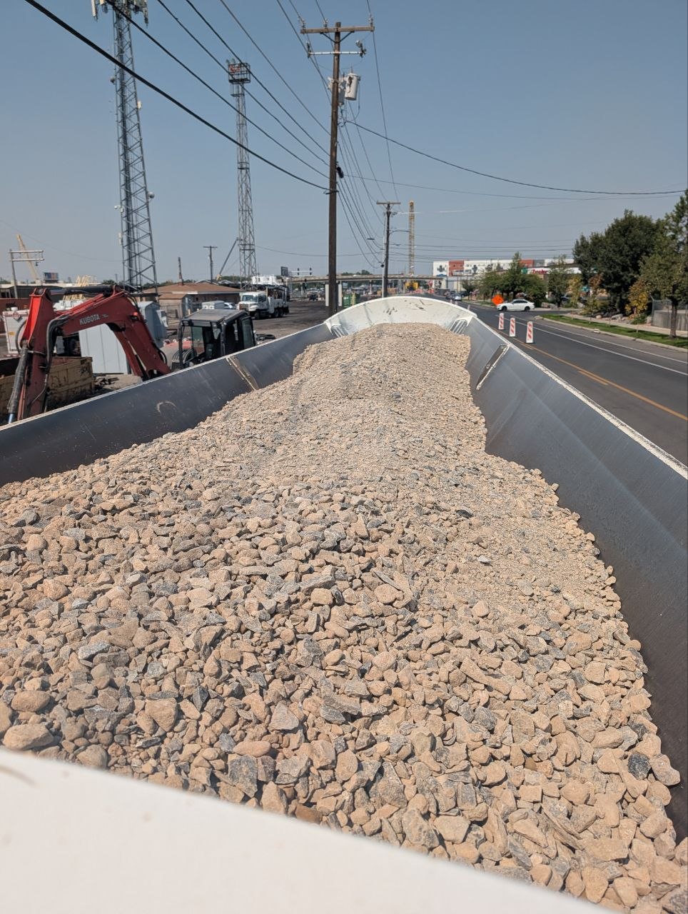 State-spec road base loaded in a dump trailer for delivery to a Provo, Utah project